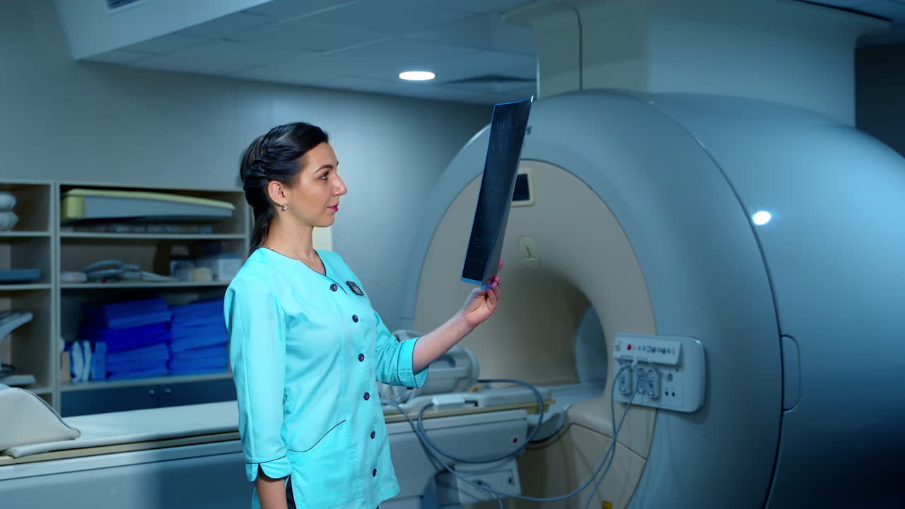 Doctor working with MRI scan results. Experienced professional oncologist looking at the MRI scan results