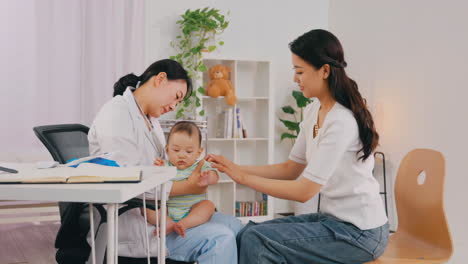 the doctor using stethoscope checking heart baby beat, pediatrician patient happy boy