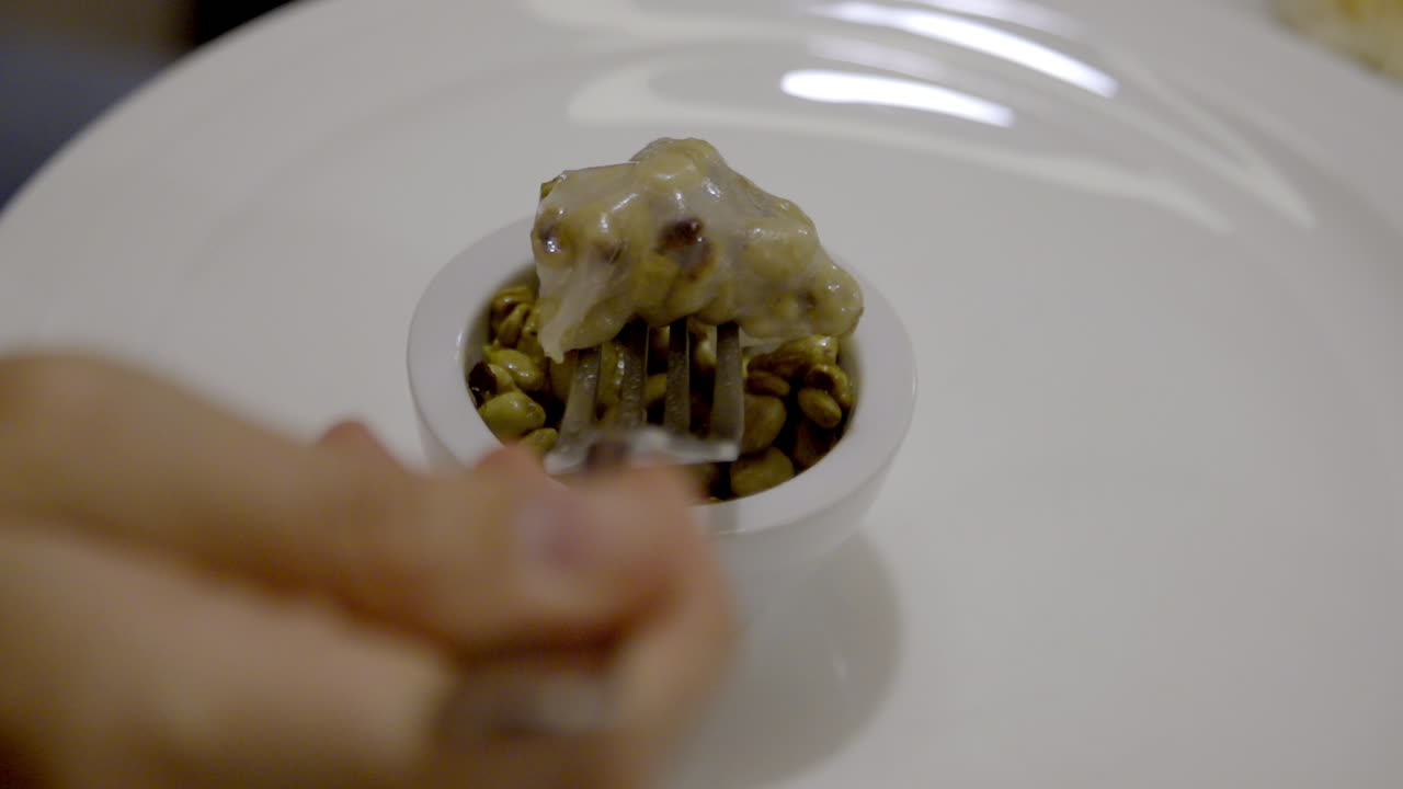 Food in a bowl with a fork