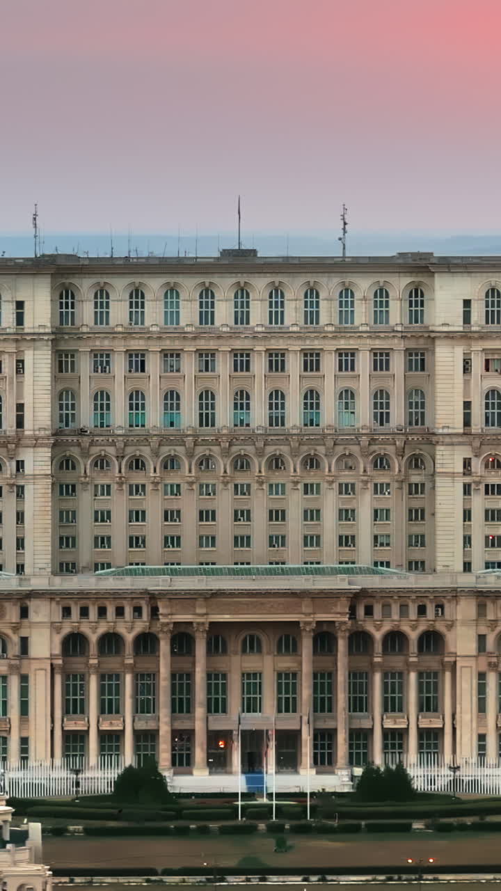 Aerial drone view of the Palace of Parliament in Bucharest, Romania at sunset. Vertical