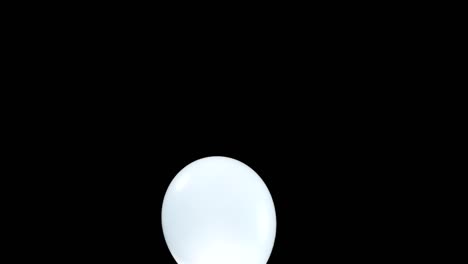 a light blue balloon gently falls from top to bottom, capturing a peaceful and graceful descent. the simplicity of the moment highlights the soft beauty of the balloon as it floats through the air.
