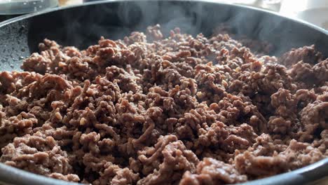 Steaming-hot-minced-meat-close-up-in-a-frying-pan