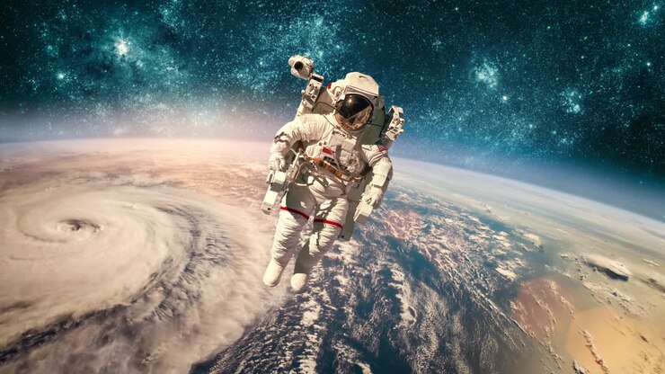 Astronaut in outer space against the backdrop of the planet earth. Typhoon over planet Earth.