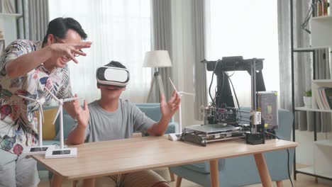 father and son learning 3d printing and vr