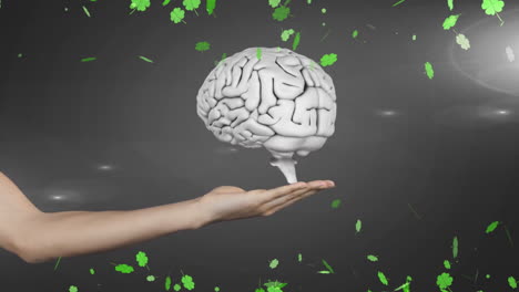 holding brain model with green clovers floating around in animation scene