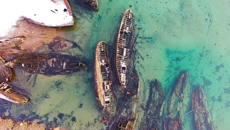 aerial view of shipwrecks in shallow coastal water