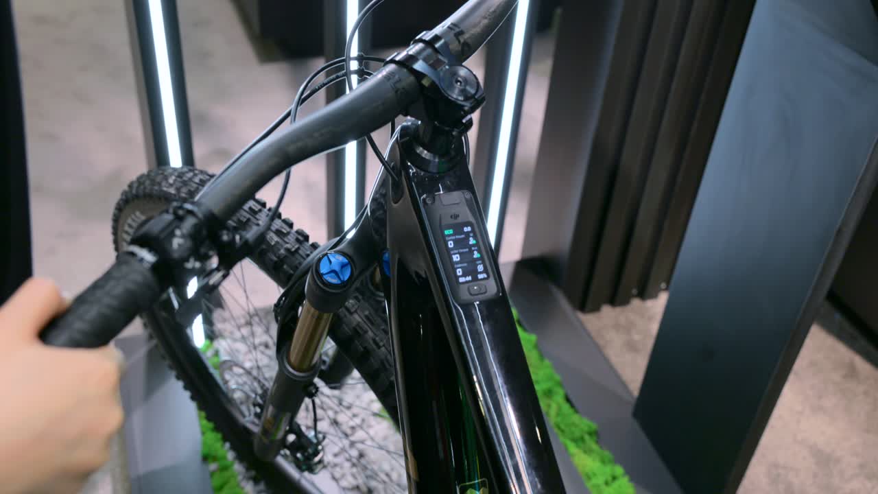 Close-up of high-tech e-bike display and handlebar controls at IFA Berlin. Showcasing the latest in electric bike technology and innovation