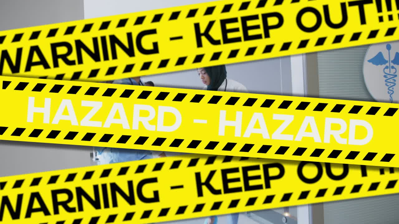 Yellow police tapes with Warning and Hazard text against doctors wheeling a bed in hospital
