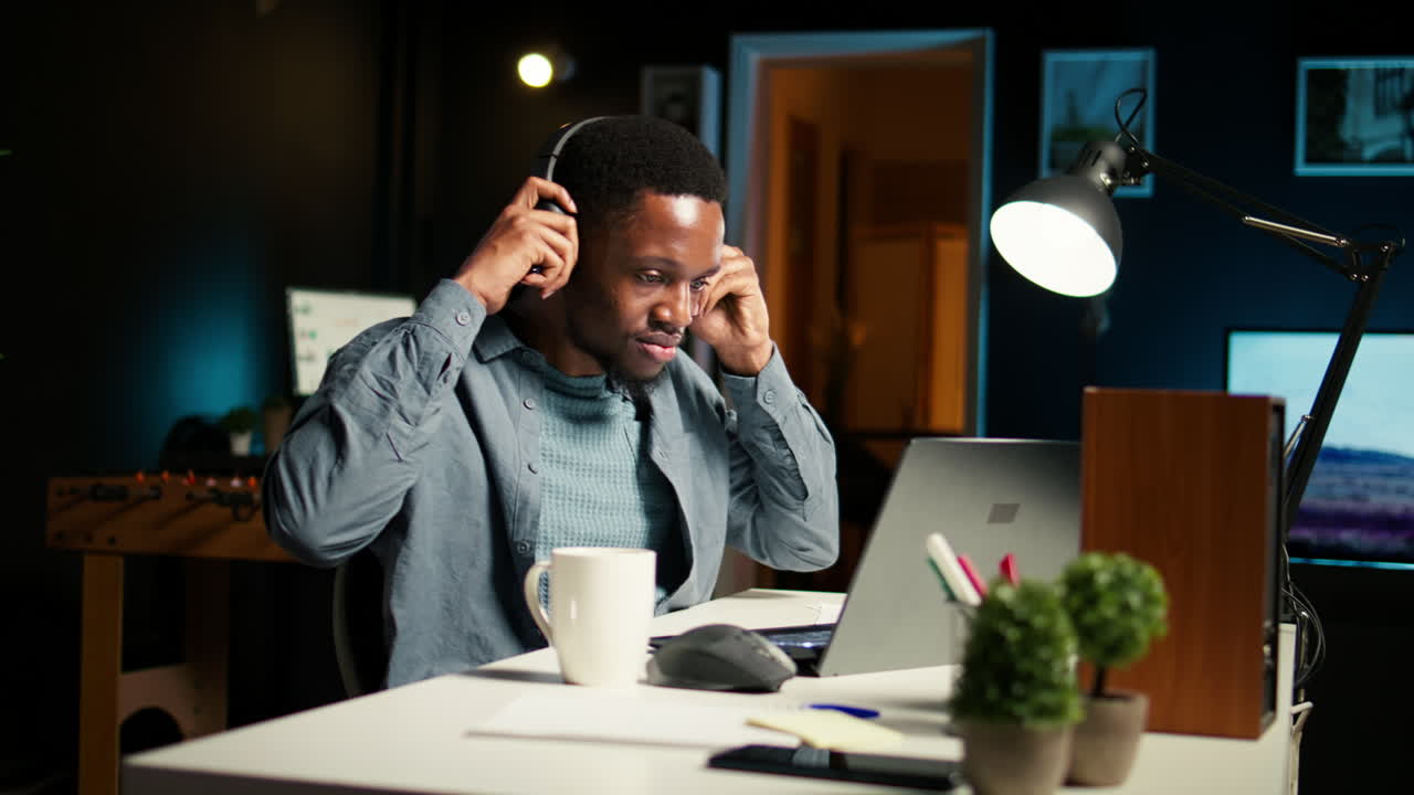 African american specialist closing the monthly balance with a show on headset