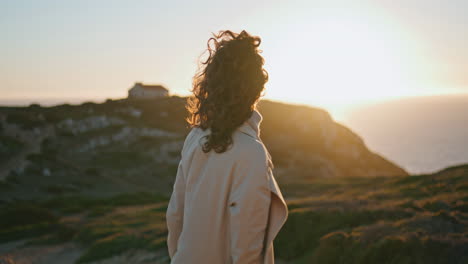 Beautiful-woman-posing-sunset-ocean-view.-Relaxed-tourist-admiring-seaside