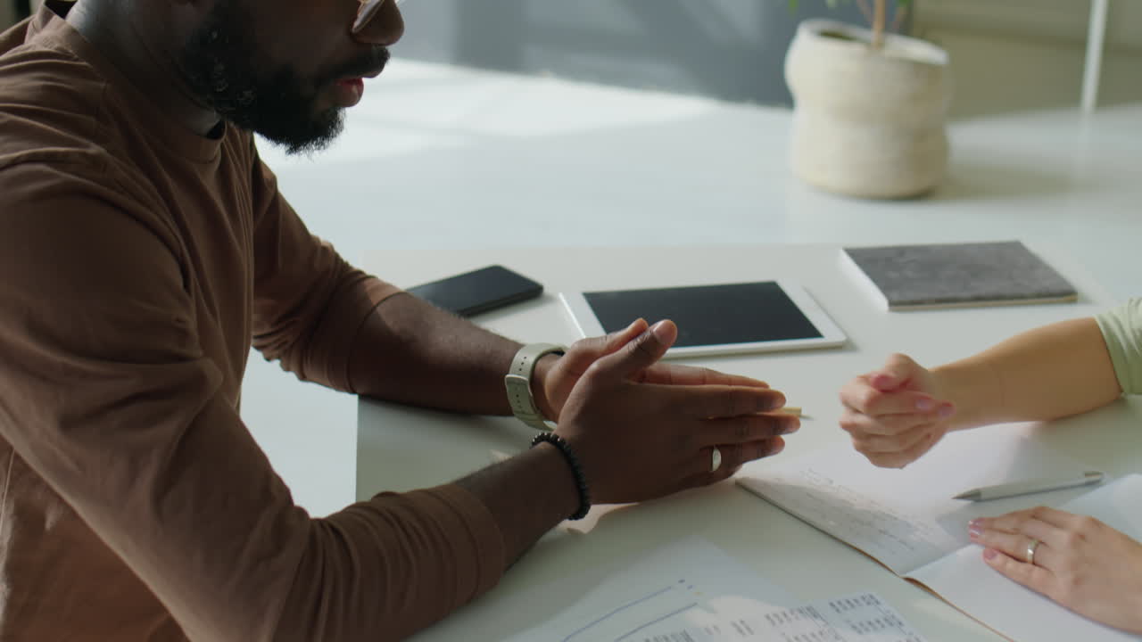 Diverse Man and Woman Shaking Hands on Office Meeting