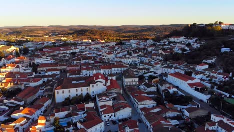 drone shot flying over a village with white houses in alentejo, portugal