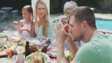 happy family eating together at table