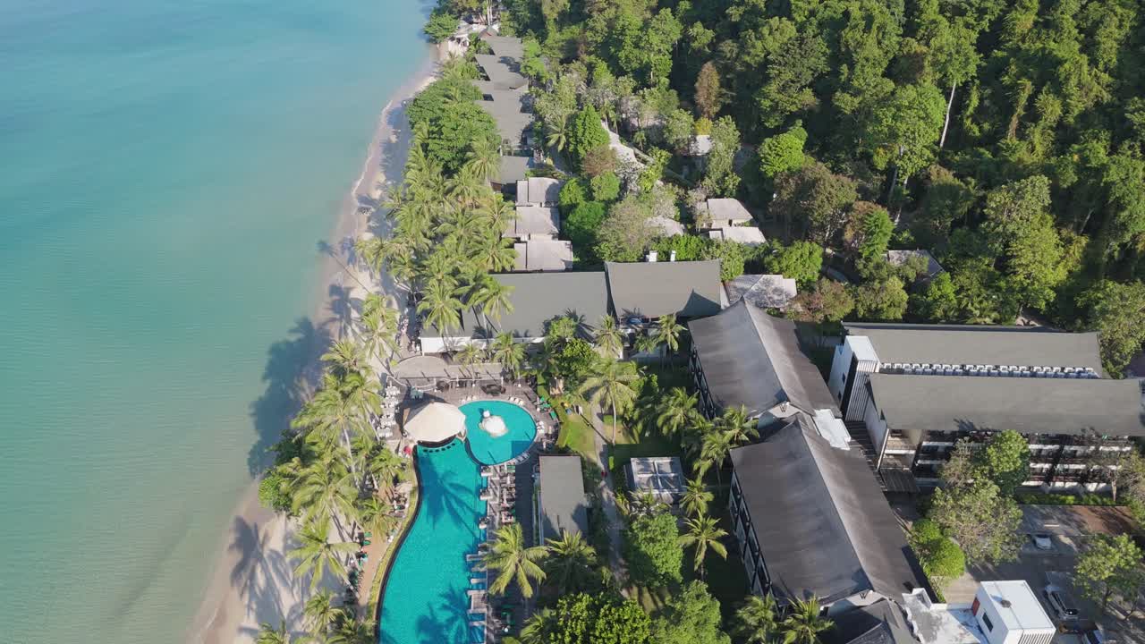 Stunning drone view of Hat Sai Khao village on Koh Chang, Thailand. Sunny morning aerial views of beaches, roads, and island landscapes
