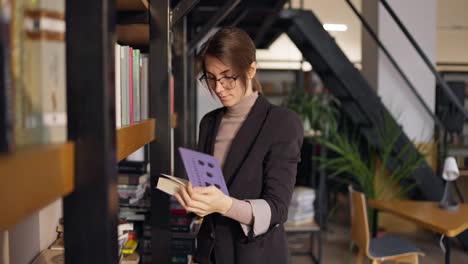 woman reading in a modern library