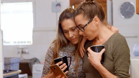 Lesbian-couple-discussing-over-a-mobile-phone-4k