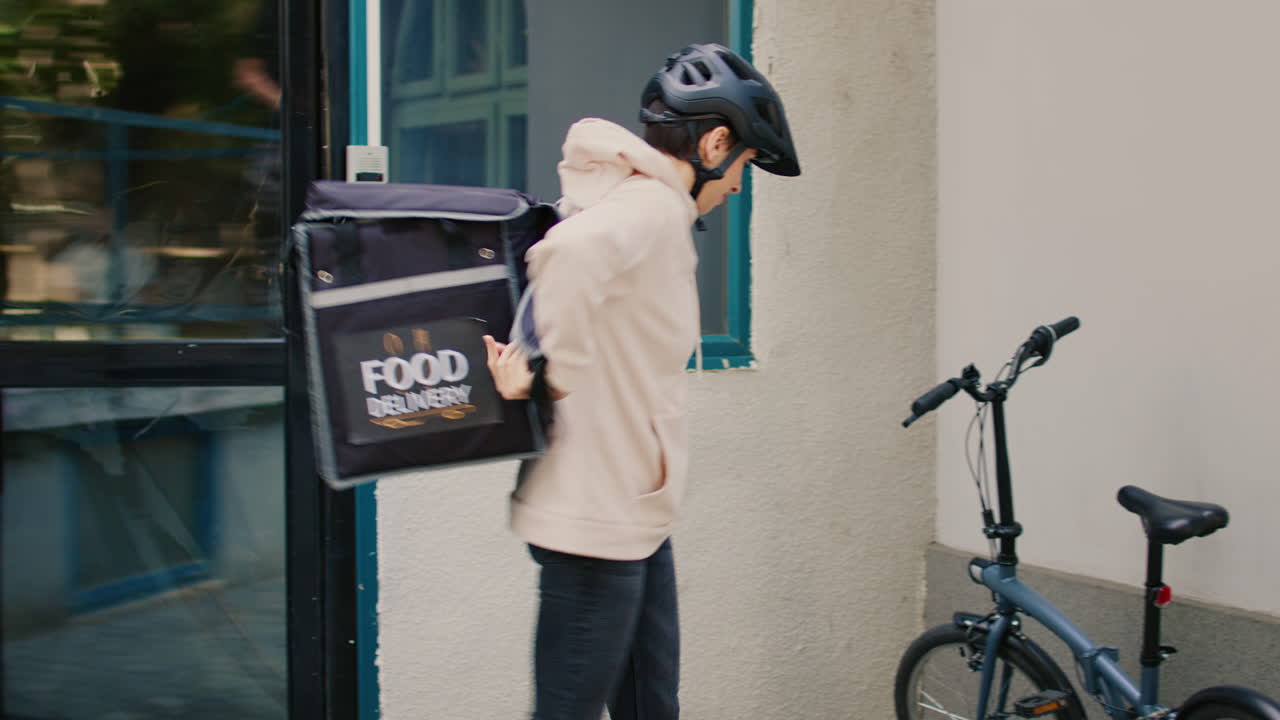 Food delivery person with package on bicycle