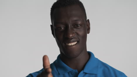 Happy-African-american-man-on-grey-background.