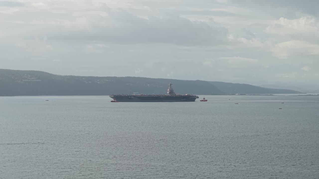USS Gerald R. Ford Carrying Aircrafts Sailing In The Fjord Of Oslo In Norway. - aerial shot
