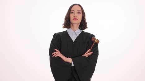 A woman dressed as a judge holding a gavel