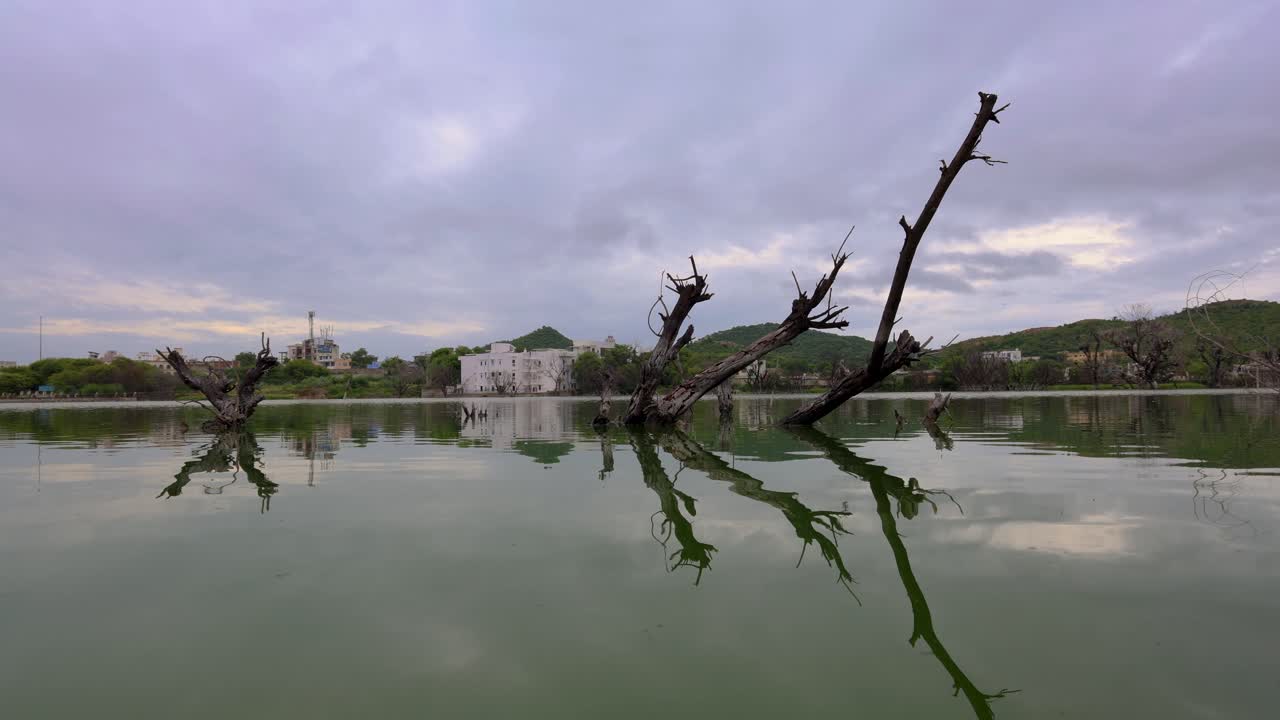 Morning Timelapse of pristine Calm Lake with Bright Sky and Wood Reflection at morning