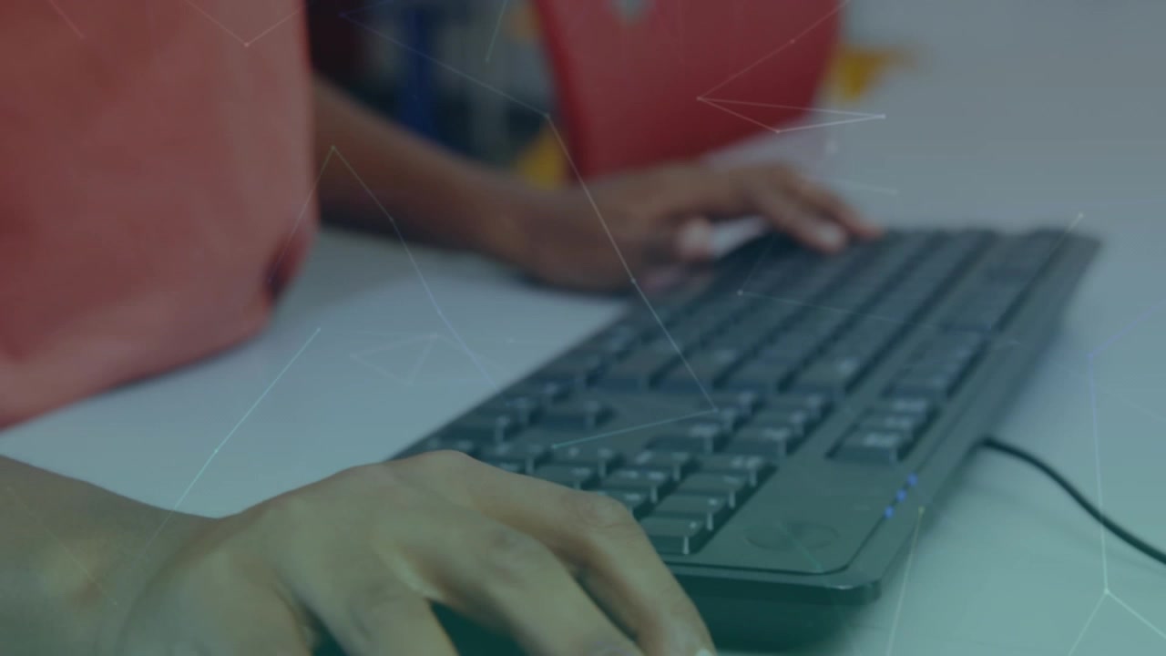 Person Typing on Computer Keyboard in Office Setting