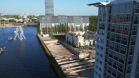 amazing aerial top view flight molecule man on border river spree, east berlin germany evening summer 23