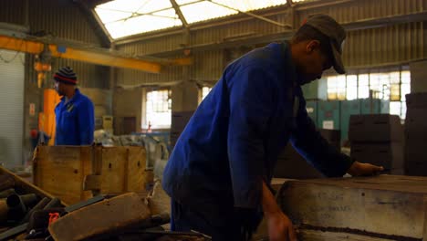 male worker arranging molds in workshop 4k