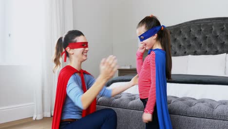 Mother-and-daughter-pretending-to-be-superhero-4k