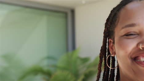 half-face portrait of a young biracial woman, with copy space