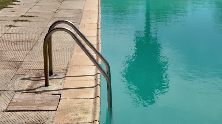 A swimming pool and a ladder at a resort in Cape Town, South Africa