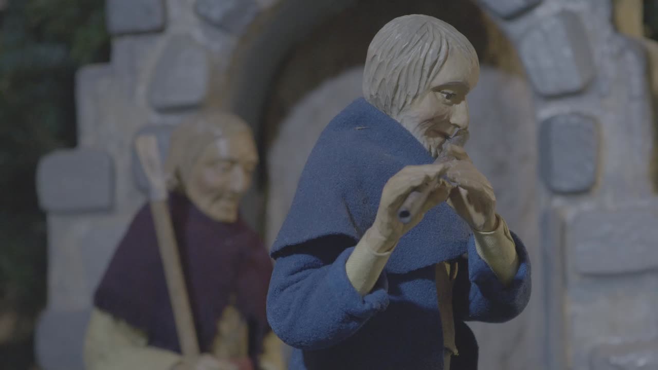 출생 장면에서 그리스도 아이에게가는 길에 두 명의 목자가 플루트를 연주합니다.