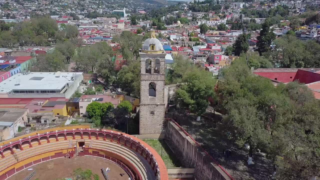 Drone footage of the historic bullring Plaza de Toros Jorge Aguilar in Tlaxcala, Mexico. Aerial view of the circular structure and streets