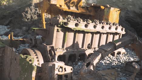 Decaying-remnants-from-a-straight-eight-Marine-diesel-engine-on-beach-Medium-Shot