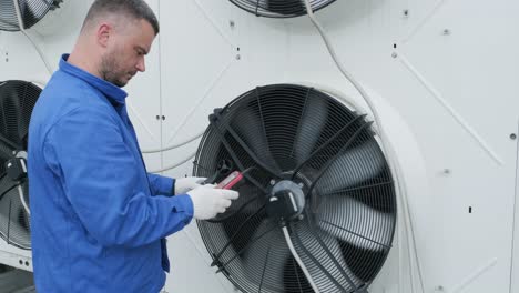 testing with an anemometer of an axial fan of the condensing unit