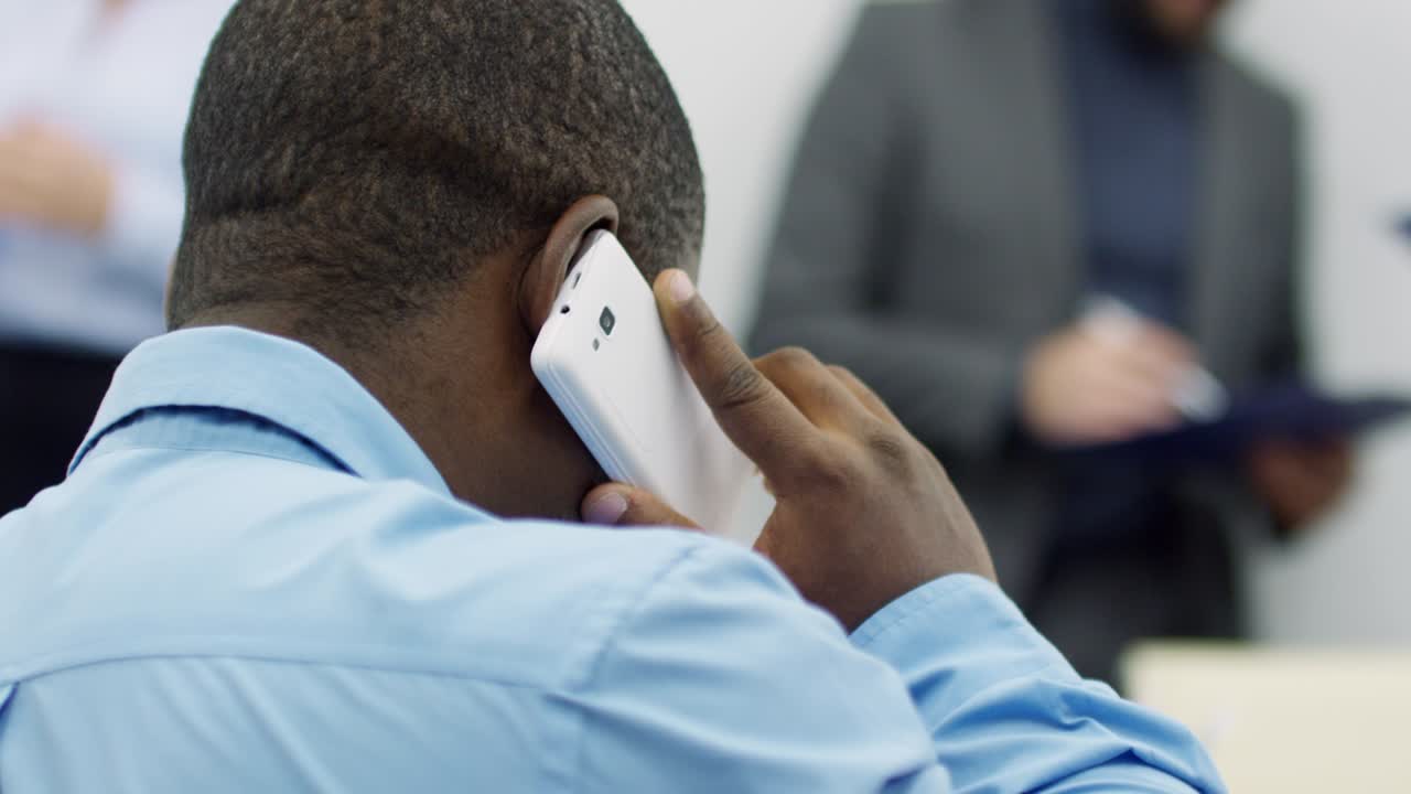 African Businessman Calling on Cell Phone