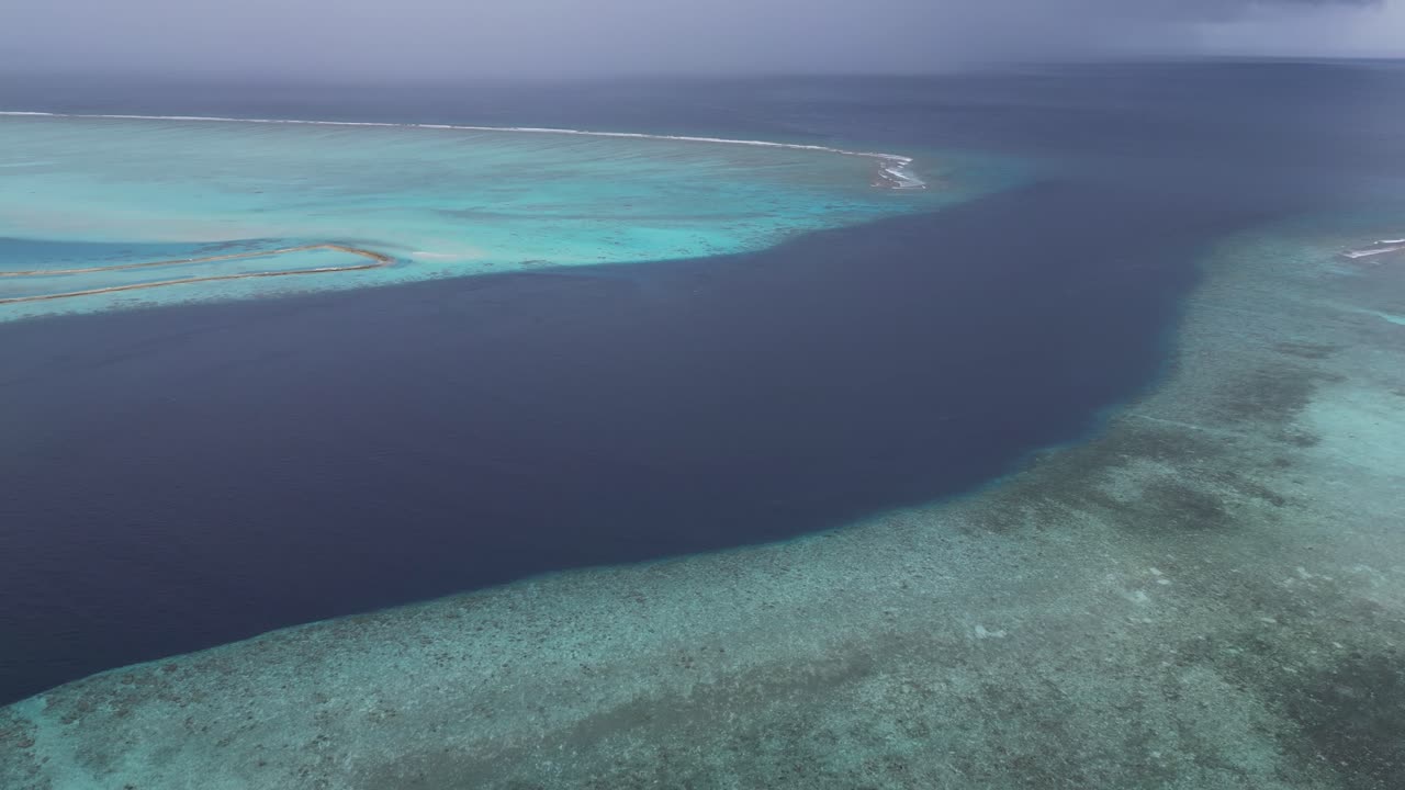 Aerial footage of storm approaching Maldives island in the Indian Ocean during monsoon rainy season
