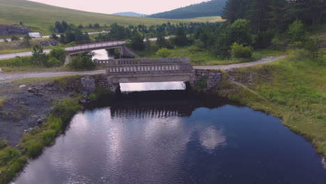 travelling towards the siberian landscapes by road with the amazing view of river and forest, a drone view