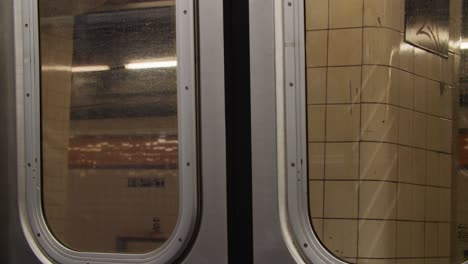 subway doors close and train speedily leaves the station