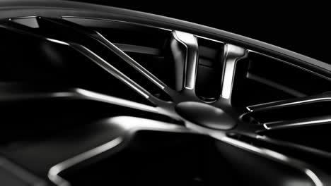 spinning car wheel on black background. loop animation