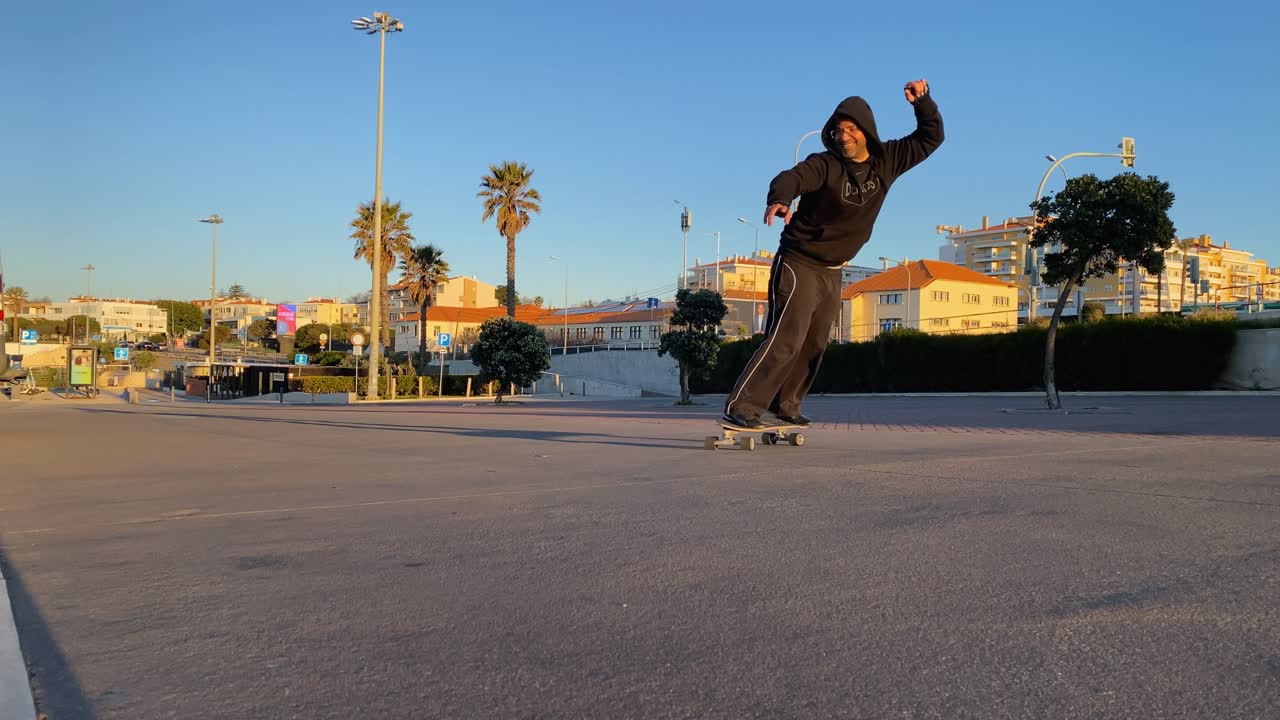 Happy male enjoy summer outdoor active lifestyle play extreme sport surf skate at public park in são pedro beach, Estoril, cascais
