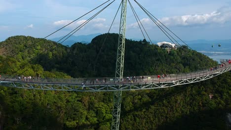 establishing drone view of langkawi sky bridge with cable cars in the background on langkawi island in malaysia