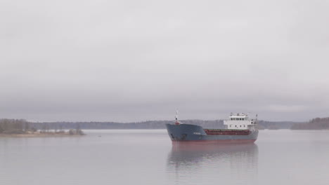 cargo ship sailing on the volga river in fog