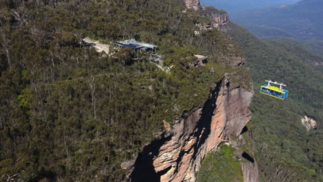 long green cable car carriage crossing the mountain at the blue mountains sydney