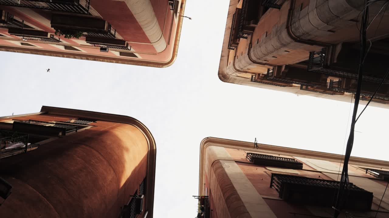 A quaint street lamp gracefully hanging in a narrow urban alley, beautifully surrounded by rustic architecture