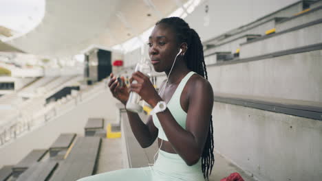 young athlete listening to music