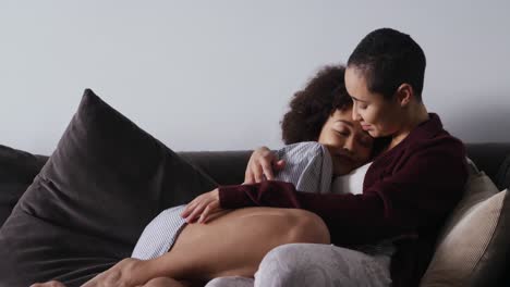 lesbian couple romancing in living room