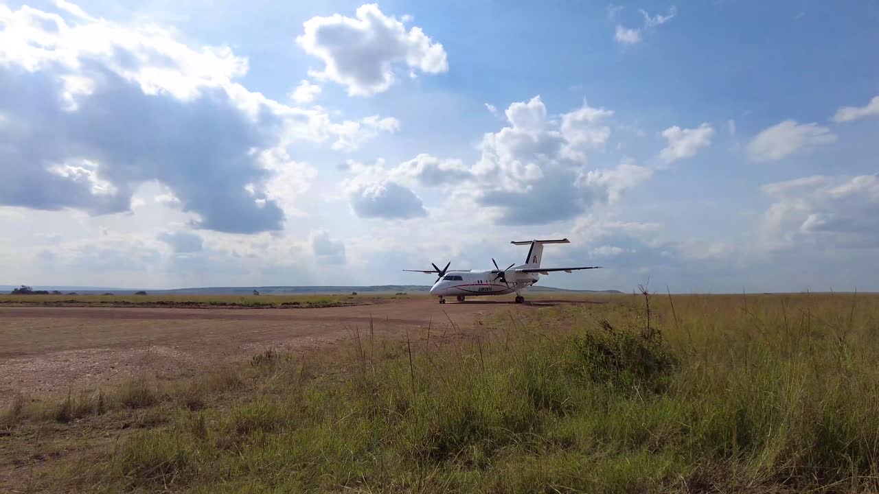 Small Airplane on Grass Runway in Africa