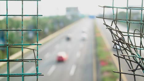 safety wire fence broken road traffic blur background