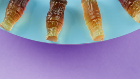 gummy soda bottles on a plate